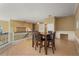 Upstairs dining area with wood floors, dark wood table and chairs, and built-in cabinets at 9128 Phillips Grove Ter, Orlando, FL 32836