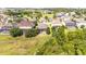 Well-manicured backyard featuring a screened-in patio with lush trees at 922 Suffolk Pl, Davenport, FL 33896