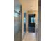 Modern bathroom showcasing an enclosed glass shower with a rainfall showerhead and tiled walls at 922 Suffolk Pl, Davenport, FL 33896