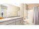 Bathroom featuring a vanity, toilet, and shower with gray tones at 922 Suffolk Pl, Davenport, FL 33896