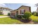 Beautiful home showcasing a well-maintained lawn and colorful landscaping at 922 Suffolk Pl, Davenport, FL 33896