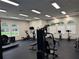 Modern fitness center with cardio equipment, weight machines and natural lighting at 922 Suffolk Pl, Davenport, FL 33896