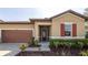 Charming single-Gathering home featuring a well-manicured lawn and inviting front entrance at 922 Suffolk Pl, Davenport, FL 33896