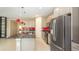 Spacious kitchen features granite countertops, stainless steel appliances, and neutral cabinets at 922 Suffolk Pl, Davenport, FL 33896