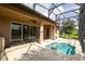 The screened-in patio has a plunge pool and is perfect for outdoor lounging and entertaining at 922 Suffolk Pl, Davenport, FL 33896