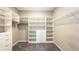 Organized walk-in closet with custom shelving and drawers to maximize storage space at 922 Suffolk Pl, Davenport, FL 33896