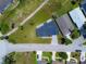 A bird's eye view of a house highlighting the new roof, landscaping, and proximity to the greenbelt at 1006 Linkside Ct, Apopka, FL 32712
