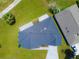 Overhead view of a house with a dark roof, new landscaping and modern driveway in a Florida community at 1006 Linkside Ct, Apopka, FL 32712