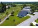 Aerial view showcasing the home, surrounding neighborhood, and lush green landscape at 1006 Linkside Ct, Apopka, FL 32712
