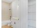 Bathroom with tiled shower/tub, modern vanity, and a well-organized linen closet for extra storage at 1006 Linkside Ct, Apopka, FL 32712