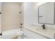 Bathroom featuring a tiled tub/shower combination, vanity with countertop, and updated fixtures at 1006 Linkside Ct, Apopka, FL 32712