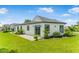 Beautiful home exterior showcasing manicured landscaping, modern architecture, and lush green lawn at 1006 Linkside Ct, Apopka, FL 32712