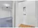 View of a modern two car garage with epoxy flooring and garage door opener at 1006 Linkside Ct, Apopka, FL 32712