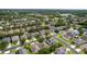 An aerial view displaying the homes in the neighborhood and the surrounding area at 10299 Cypress Knee Cir, Orlando, FL 32825