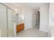 Bathroom featuring shower, vanity and tile flooring at 10299 Cypress Knee Cir, Orlando, FL 32825