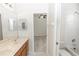 Bathroom with marble countertop, wood cabinets and a view to the bedroom at 10299 Cypress Knee Cir, Orlando, FL 32825