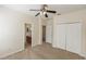 Bedroom with closet, ceiling fan and a bathroom attached at 10299 Cypress Knee Cir, Orlando, FL 32825