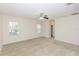 Neutral bedroom with carpet and two windows at 10299 Cypress Knee Cir, Orlando, FL 32825