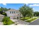 Charming two-story home with a well manicured lawn, mature landscaping, and a two-car attached garage at 10299 Cypress Knee Cir, Orlando, FL 32825