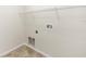 A spacious laundry room with tile floors, shelving, and washer/dryer hookups at 10299 Cypress Knee Cir, Orlando, FL 32825