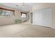 Large bonus room with multiple windows, closet, and stairs leading to another room at 1097 Harmony Ln, Clermont, FL 34711