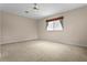 Spacious bonus room with carpet flooring and a large window offering natural light at 1097 Harmony Ln, Clermont, FL 34711