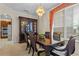 Elegant dining room features a large wooden table, chandelier, and a hutch, perfect for entertaining guests at 1097 Harmony Ln, Clermont, FL 34711