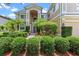 Inviting front entrance with lush landscaping and a well-maintained walkway, adding curb appeal to the property at 1097 Harmony Ln, Clermont, FL 34711