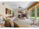 Bright living room features a fireplace, neutral carpeting and large sliding glass doors leading to the backyard at 1097 Harmony Ln, Clermont, FL 34711