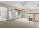 Open loft with a glass table and chair and sliding french doors to another room at 1097 Harmony Ln, Clermont, FL 34711