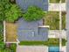 Overhead shot of the house and neighborhood, showing roof, trees, backyard, driveway, and nearby street at 1131 Tyler Lake Cir, Orlando, FL 32839