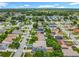 Wide aerial view showcases the neighborhood's layout, houses, and proximity to surrounding greenery at 1131 Tyler Lake Cir, Orlando, FL 32839