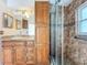 Bathroom with a vanity featuring a granite countertop, and a glass shower at 1131 Tyler Lake Cir, Orlando, FL 32839