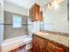 Bathroom with granite vanity, tile flooring and bathtub at 1131 Tyler Lake Cir, Orlando, FL 32839
