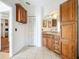 Bathroom boasts a vanity with a granite countertop and cabinet space, complemented by a closet at 1131 Tyler Lake Cir, Orlando, FL 32839