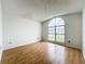 Bedroom featuring hardwood flooring, and a large window at 1131 Tyler Lake Cir, Orlando, FL 32839