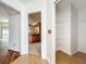 Hallway that provides views of the kitchen and closet creating a seamless transition between functional spaces at 1131 Tyler Lake Cir, Orlando, FL 32839