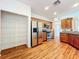 Open kitchen with wood flooring, stainless appliances including refrigerator, range and microwave at 1131 Tyler Lake Cir, Orlando, FL 32839
