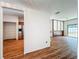 Spacious living area with hardwood floors, an open layout, and stainless steel refrigerator at 1131 Tyler Lake Cir, Orlando, FL 32839