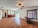 Spacious living room with hardwood floors, ceiling fan and sliding door to backyard at 1131 Tyler Lake Cir, Orlando, FL 32839