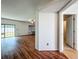 Open floorplan featuring hardwood floors, bright walls, and access to the backyard through glass doors at 1131 Tyler Lake Cir, Orlando, FL 32839