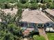 Aerial view of the house showing the screened lanai and tile roof at 11854 Delfina Ln, Orlando, FL 32827