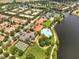 Aerial view of community amenities, including pools, tennis courts, and a clubhouse at 11854 Delfina Ln, Orlando, FL 32827