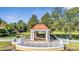 Picturesque gazebo on manicured green lawn; features a copper-colored roof, white columns, and decorative railing, with mature trees at 11854 Delfina Ln, Orlando, FL 32827