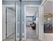 Hallway featuring a sliding mirror closet, and doorways to a living room and dining area at 11854 Delfina Ln, Orlando, FL 32827