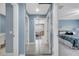 Hallway features a sliding mirror closet, bathroom access, and a bedroom at 11854 Delfina Ln, Orlando, FL 32827