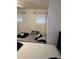 This is a shot of the bedroom featuring two twin mattresses and bright natural light through the windows at 13252 Vennetta Way, Windermere, FL 34786