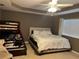 Cozy bedroom with white bedding, a bunk bed, and a ceiling fan at 13252 Vennetta Way, Windermere, FL 34786
