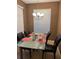 Dining room features a modern table and chairs beneath a chandelier at 13252 Vennetta Way, Windermere, FL 34786