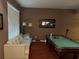 This is a shot of the game room featuring a pool table, couch, and large window at 13252 Vennetta Way, Windermere, FL 34786